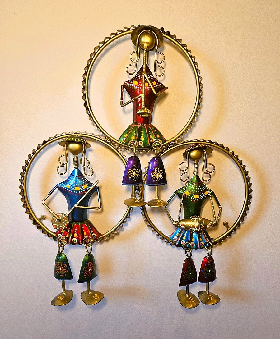 Eclectic handcrafted iron-and-brass musician figurines mixing colour and form
