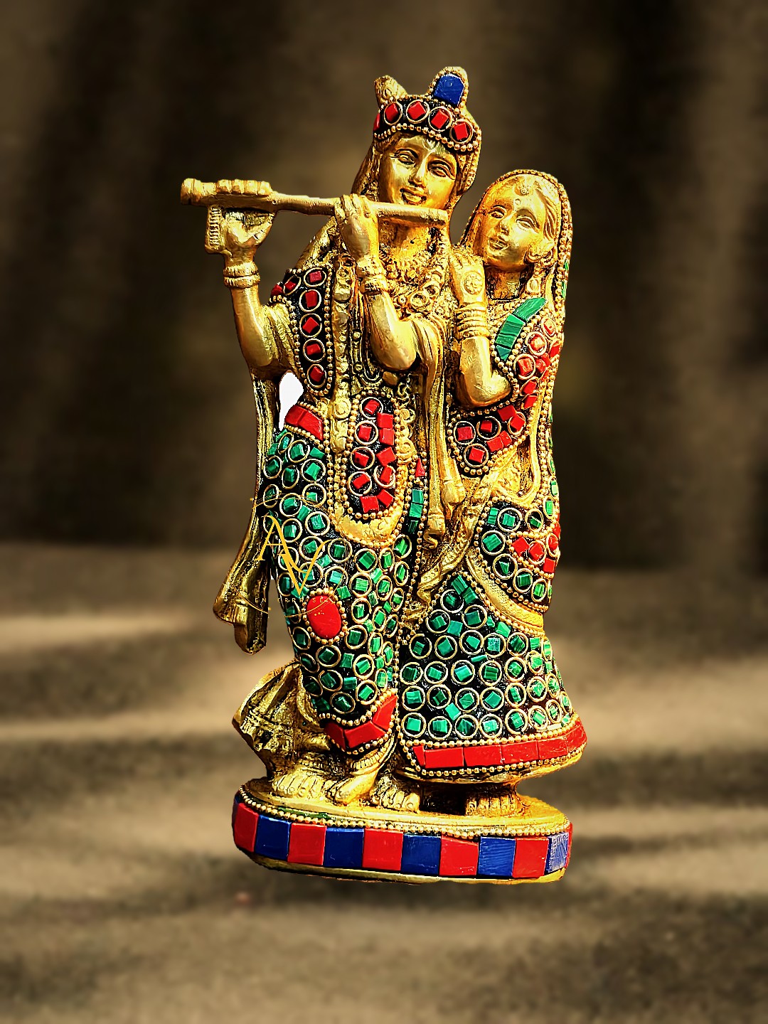 Handcrafted brass Radha Krishna idol with hand-set red coral and green malachite stonework